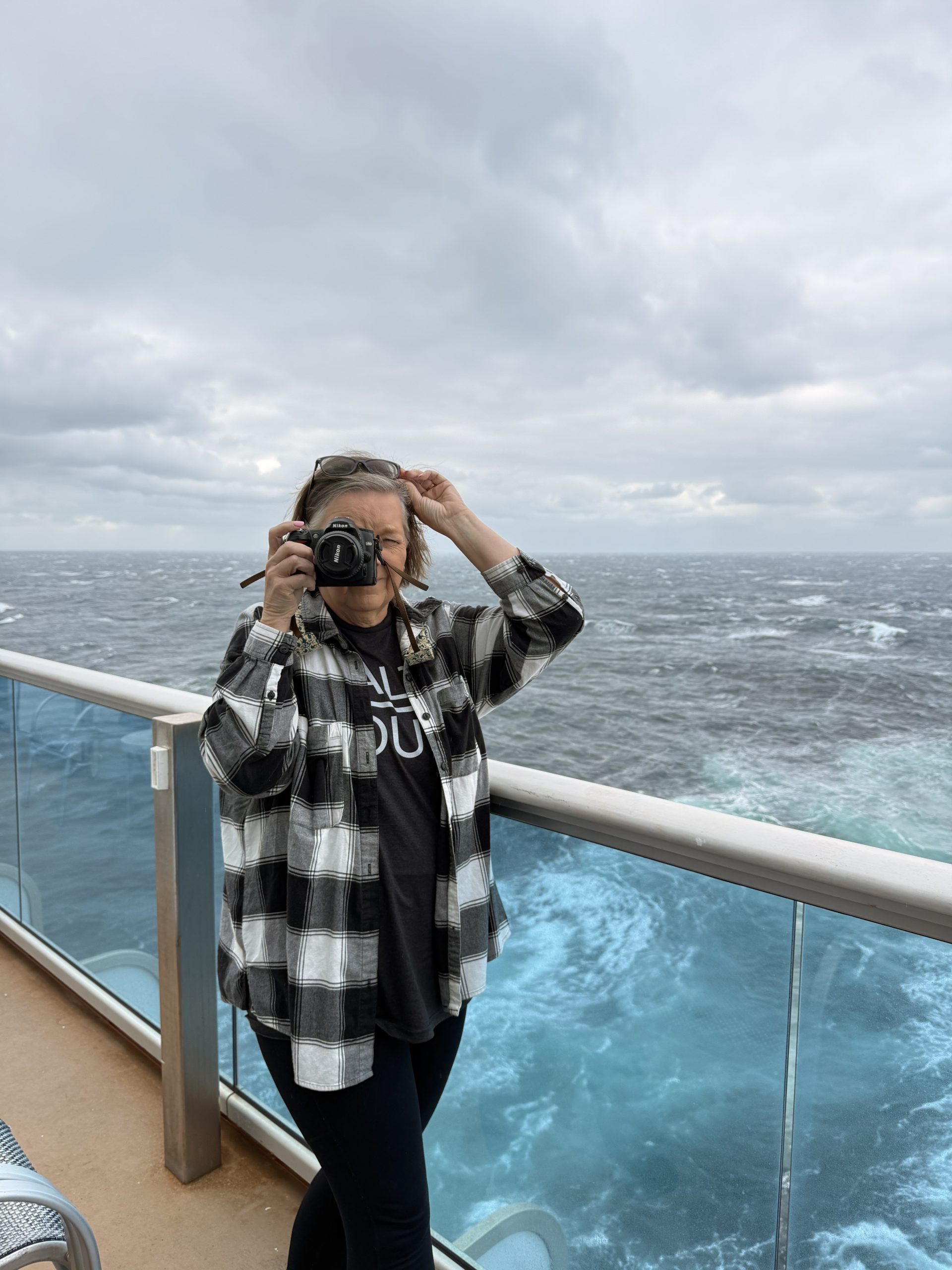 Woman on ship with camera